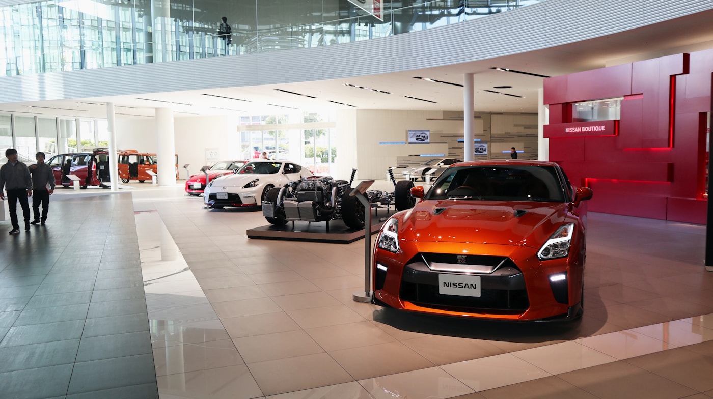 Car dealership showroom — every person in here is trained to take money from buyers
